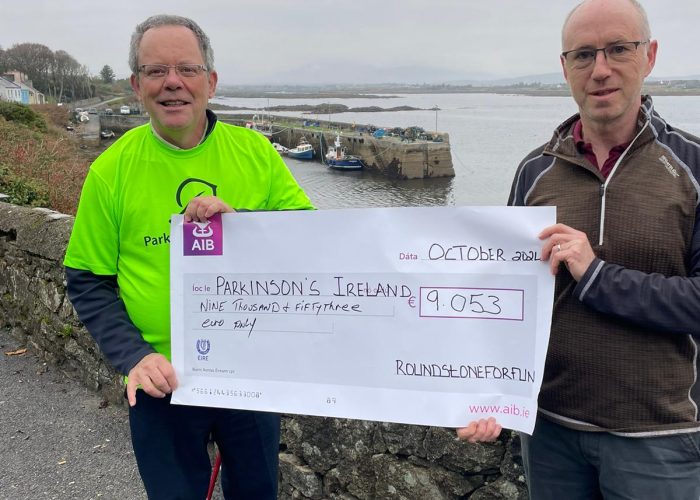 Nicholas Griffin presents a cheque for €9,053 to Gerard Loughnane from Galway Parkinsons Association